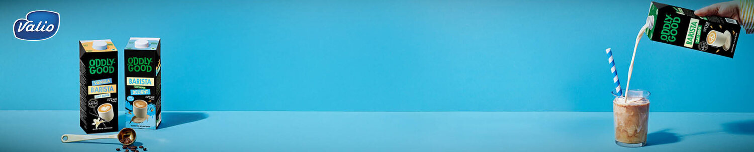 Valio Oddlygood -purkkeja ja lasi, jossa pilli.